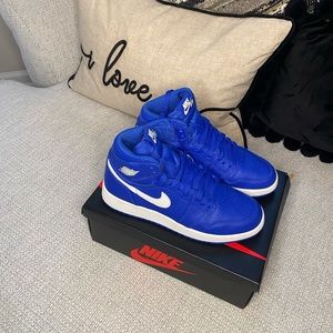 Nike air 1 Jordan's colors royal blue and white. Size 5 in grade school.
